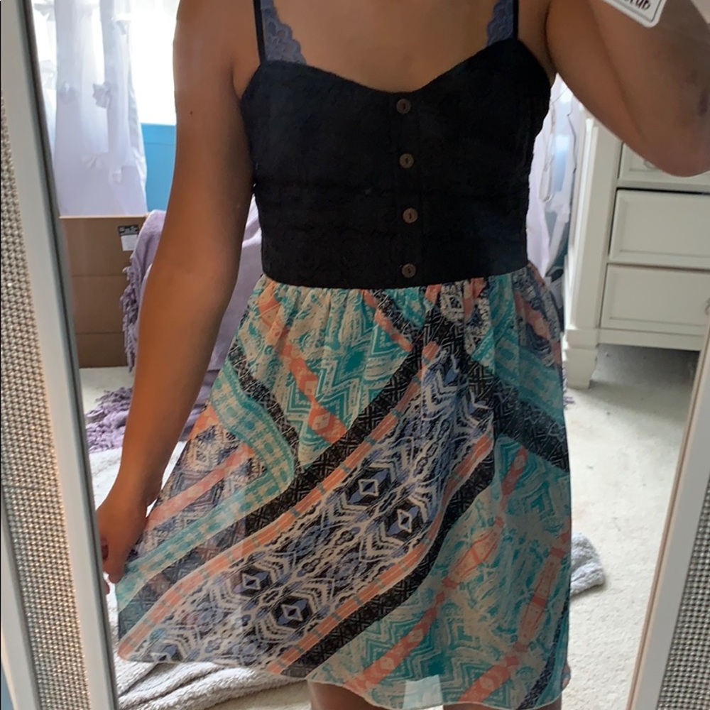 Black and blue dress with button on the top